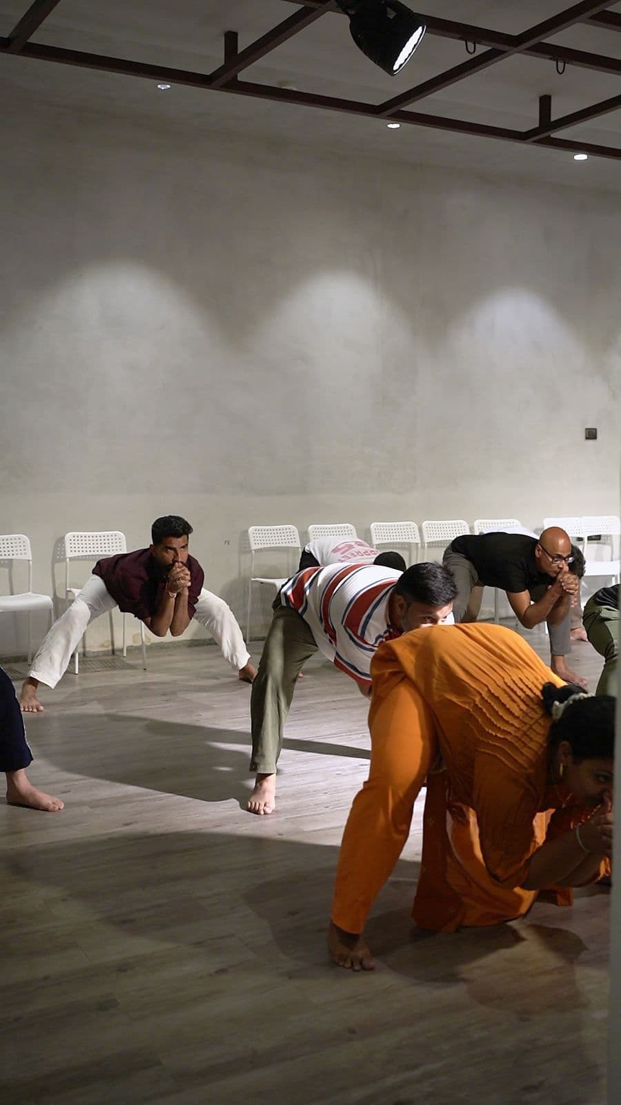 Participants bent low to the floor during the body work
