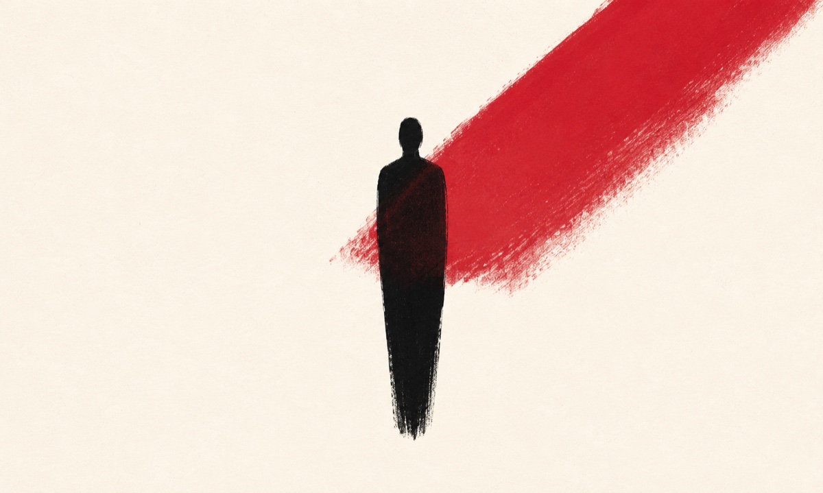 Ink silhouette under a crimson stage-light wedge