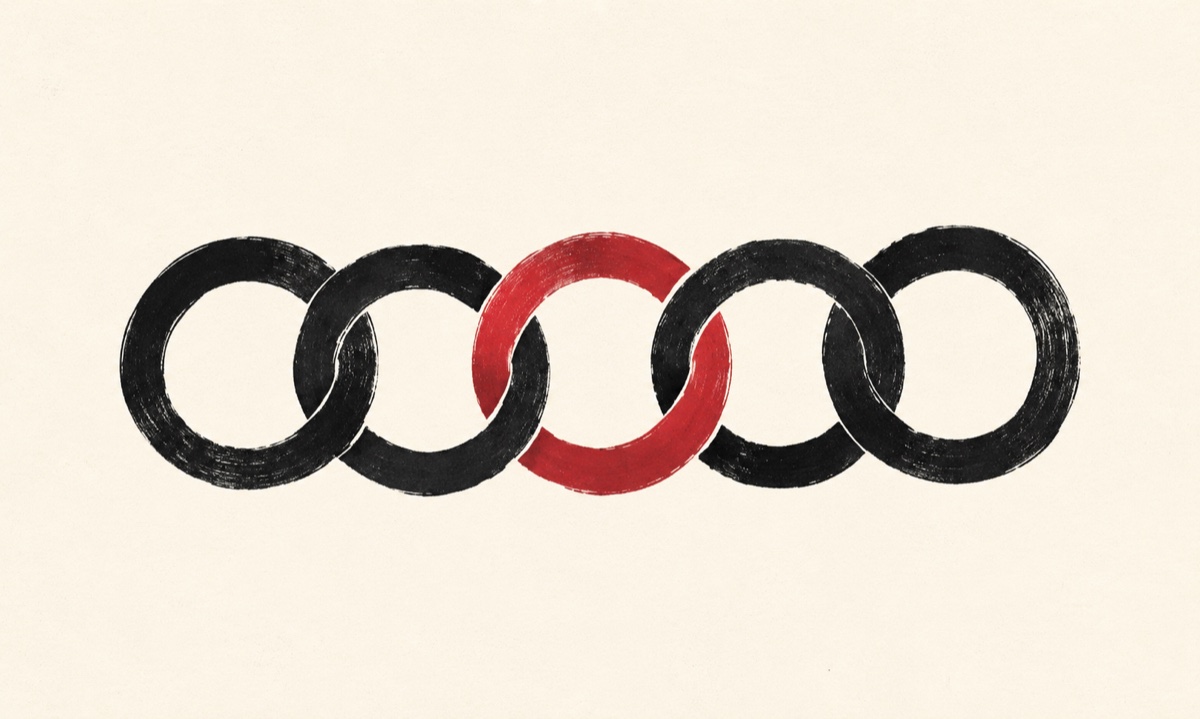 Five interlinked ink rings, the middle one filled with crimson