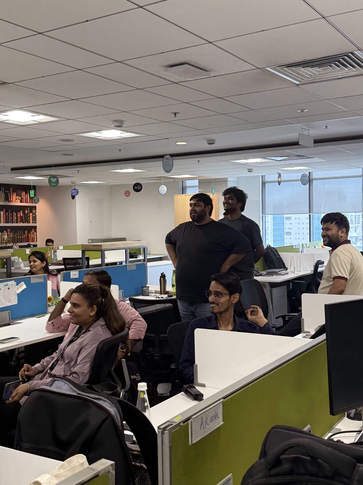 PayU employees watching a floor performance from their desks — theatre brought to where people sit