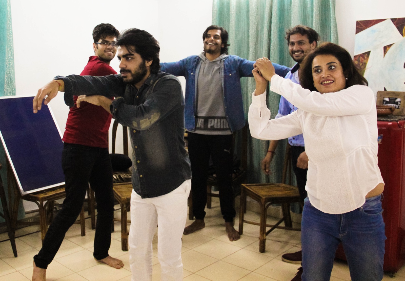 Participants linking arms in a coordination exercise